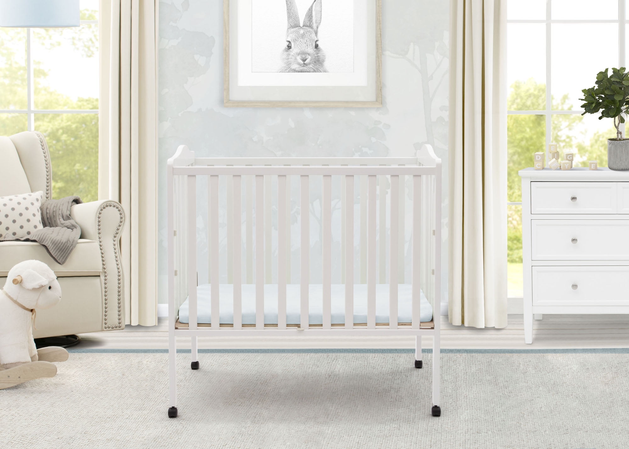 Delta Children Folding Portable Baby Mini Crib with 1.5-inch Mattress, White - Image 7