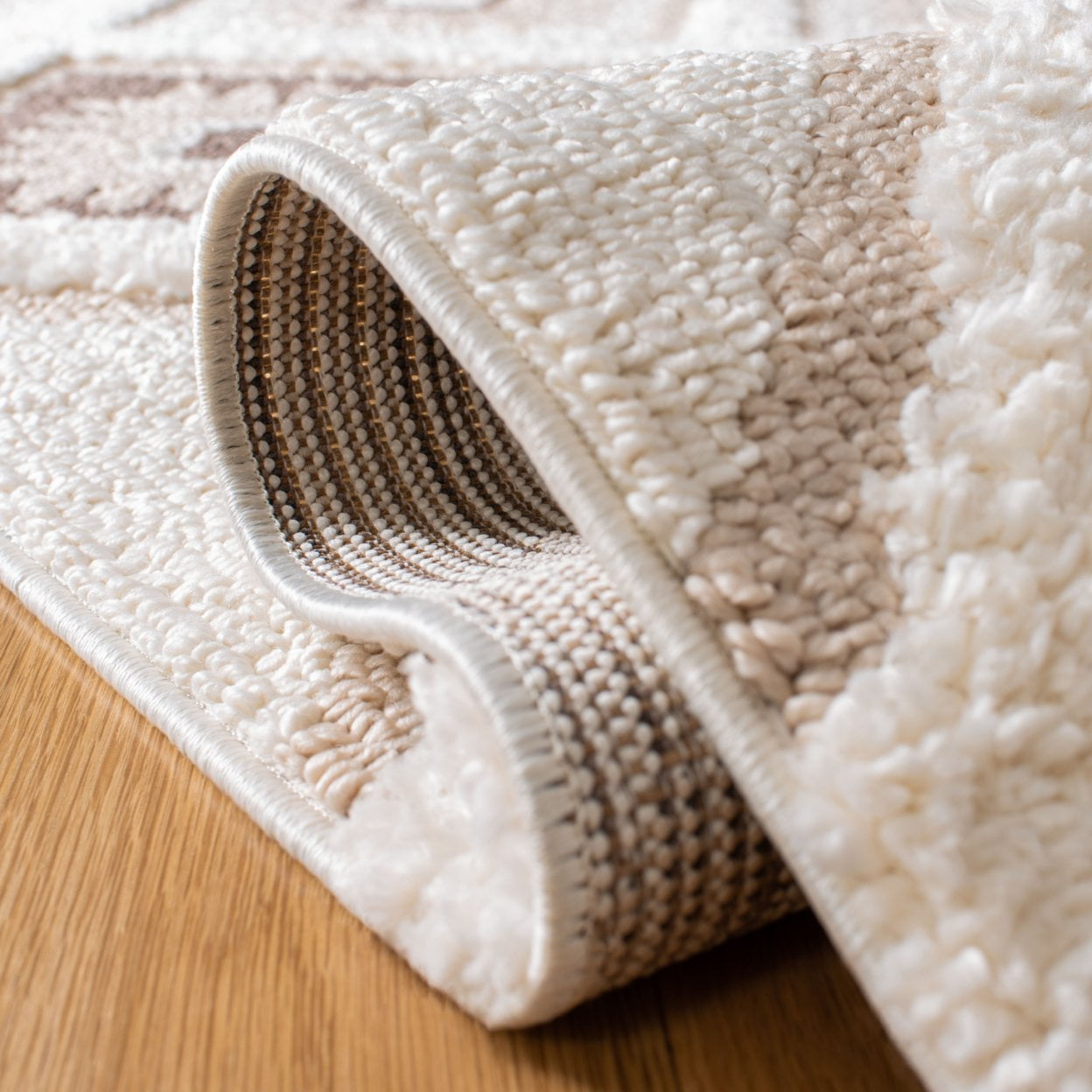 SAFAVIEH Moroccan Tassel Shag Elsie Moroccan Geometric Area Rug, Ivory/Brown, 5'3" x 7'6" - Image 10