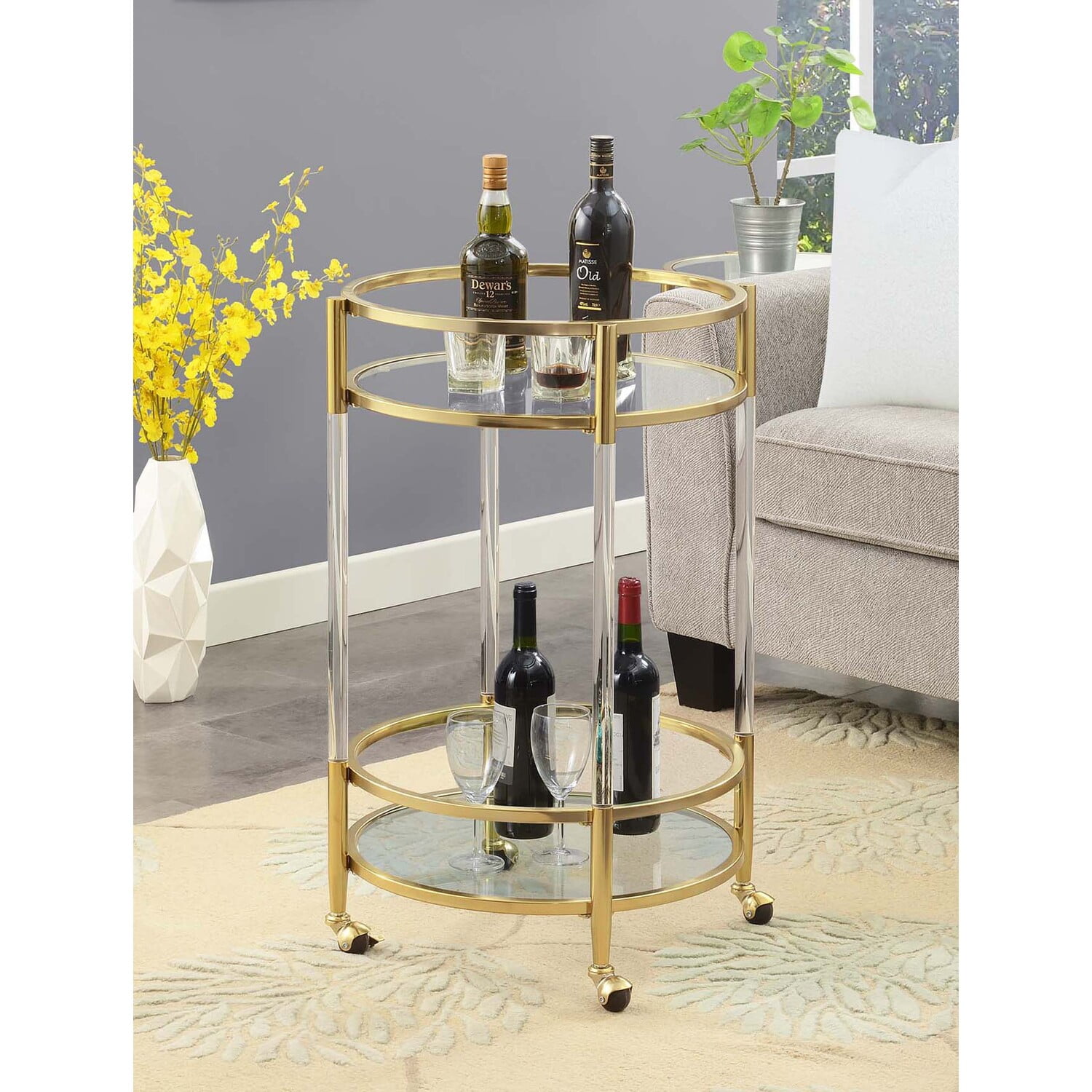 Royal Crest Two-Tier Acrylic Round Bar Cart in Clear Glass with Gold Metal Frame